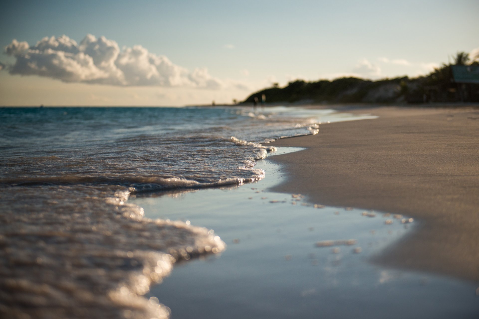 waves sand spring close up anguilla