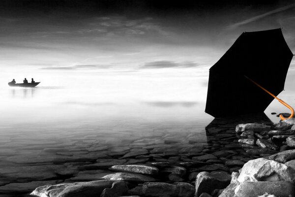 A boat floating away into the distance. black umbrella on the shore