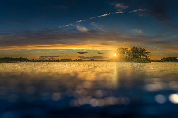 Fabulous sunset on a lake with an island