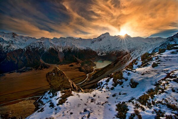 Sunny peaks of snowy mountains