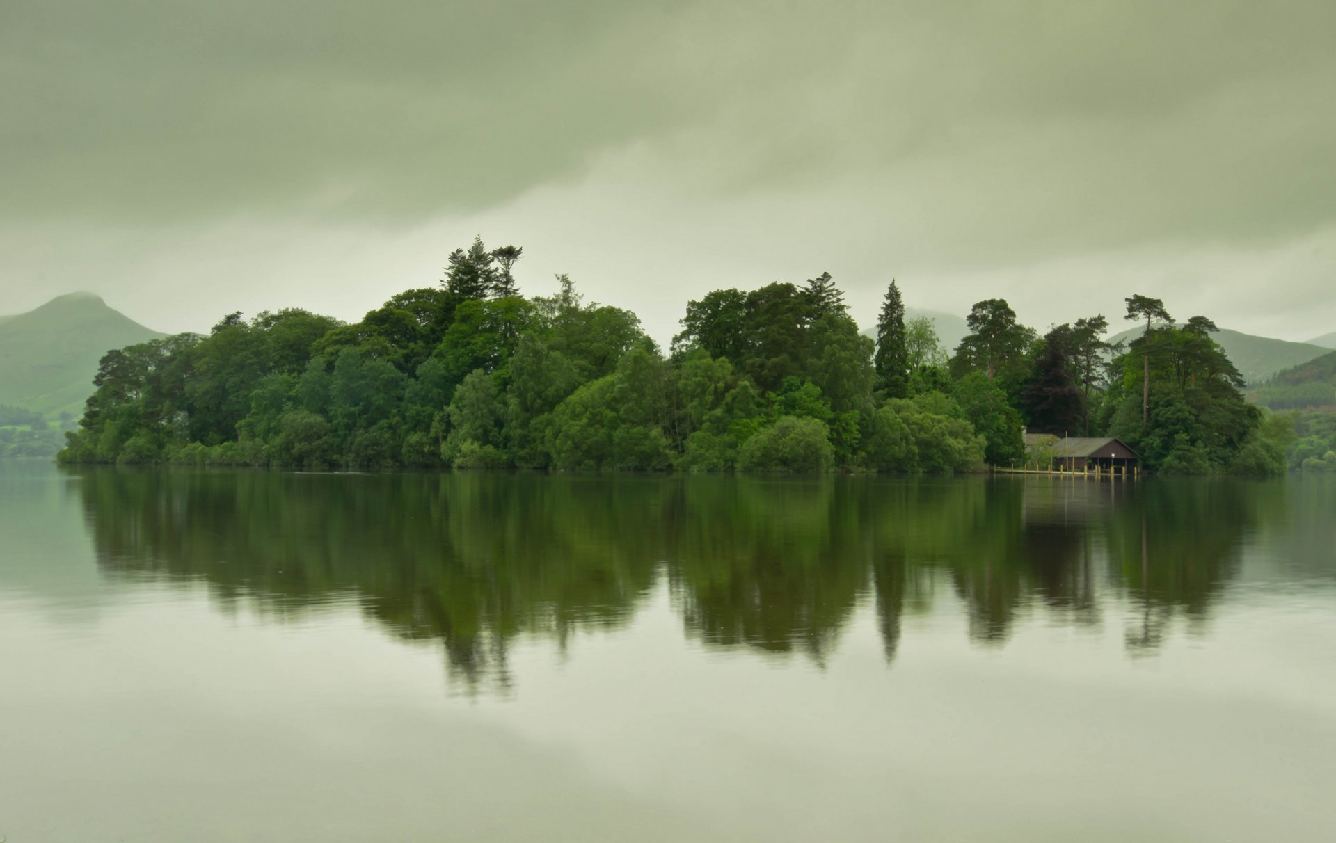 mountain lake island house in water