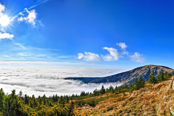 The sun over the national Park in the Czech Republic with a view of the mountains