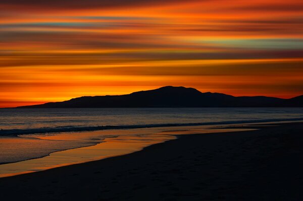 Orange Sonnenuntergang am Strand