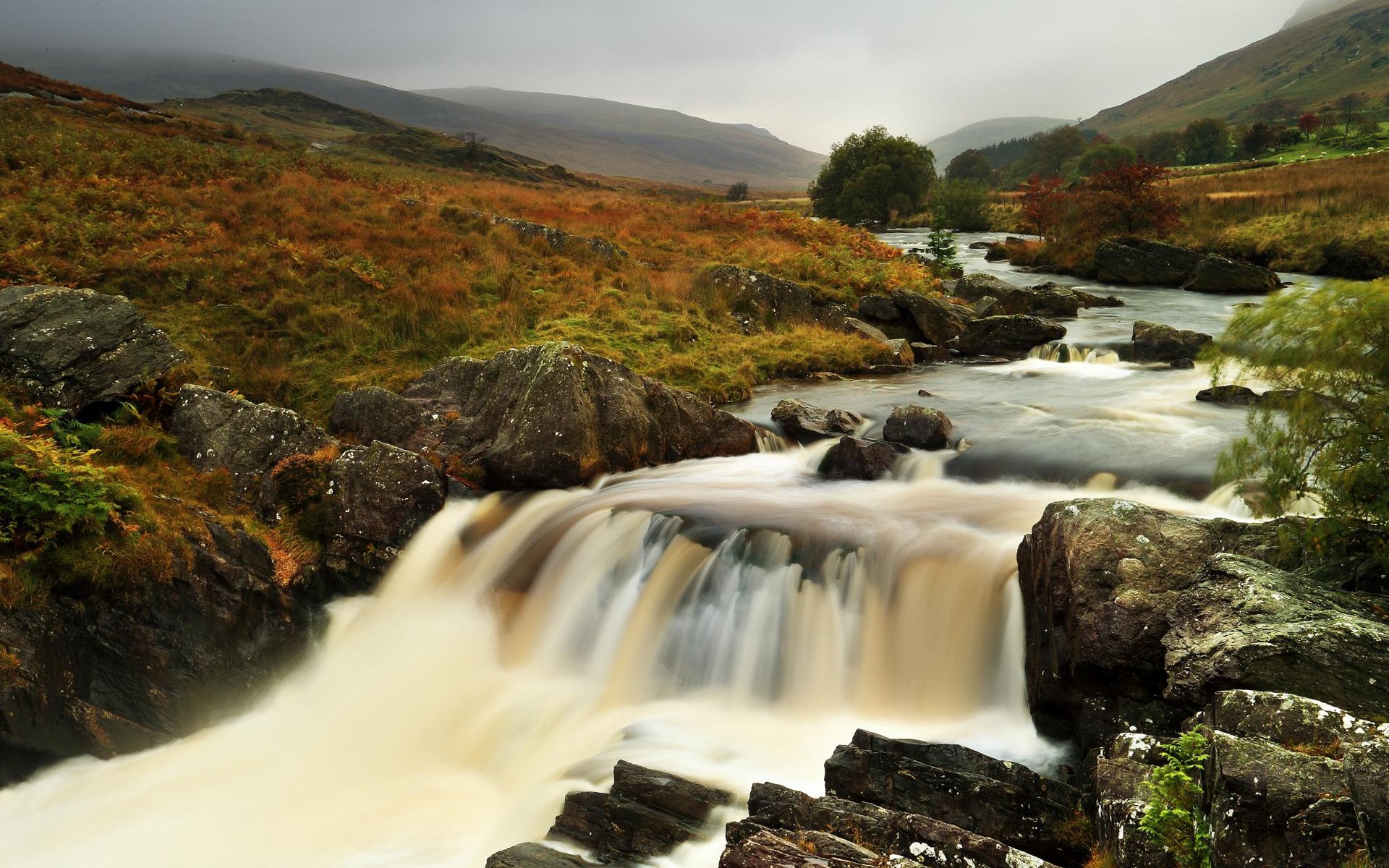 river feed stones hills grass autumn