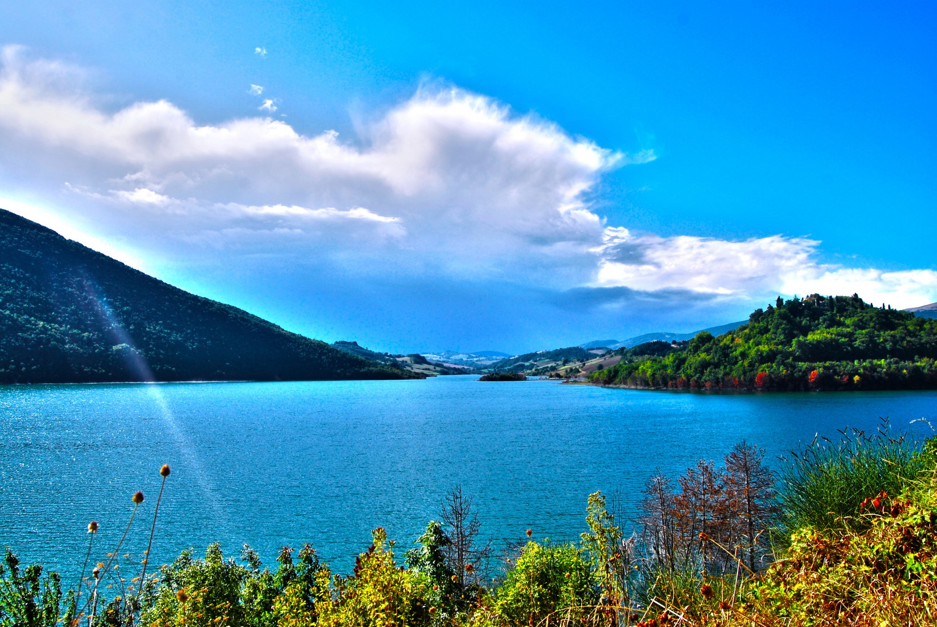 autumn lake castreccioni water shore vegetation mountain sky clouds italy