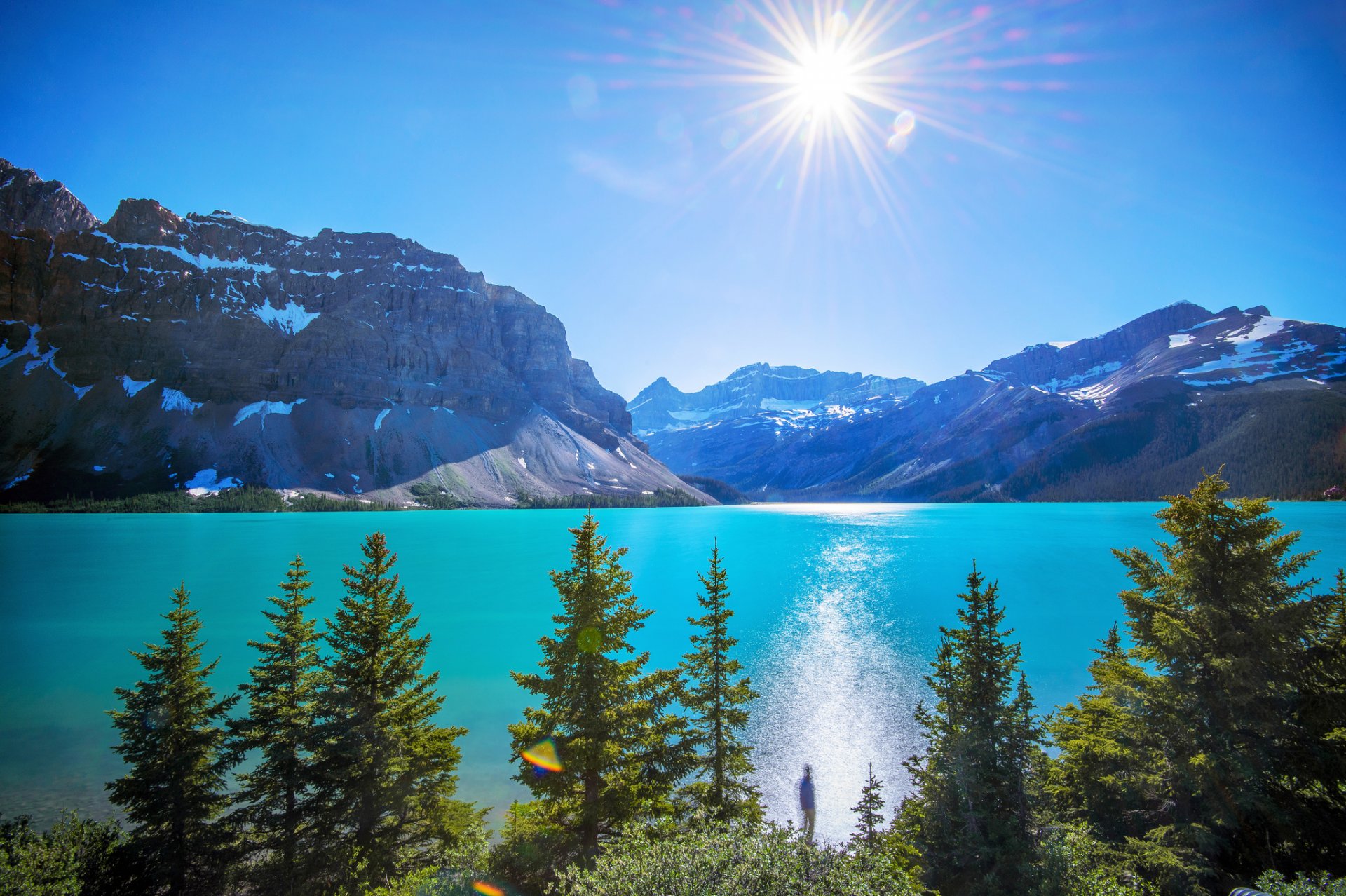 montagnes lac arbres soleil éblouissement