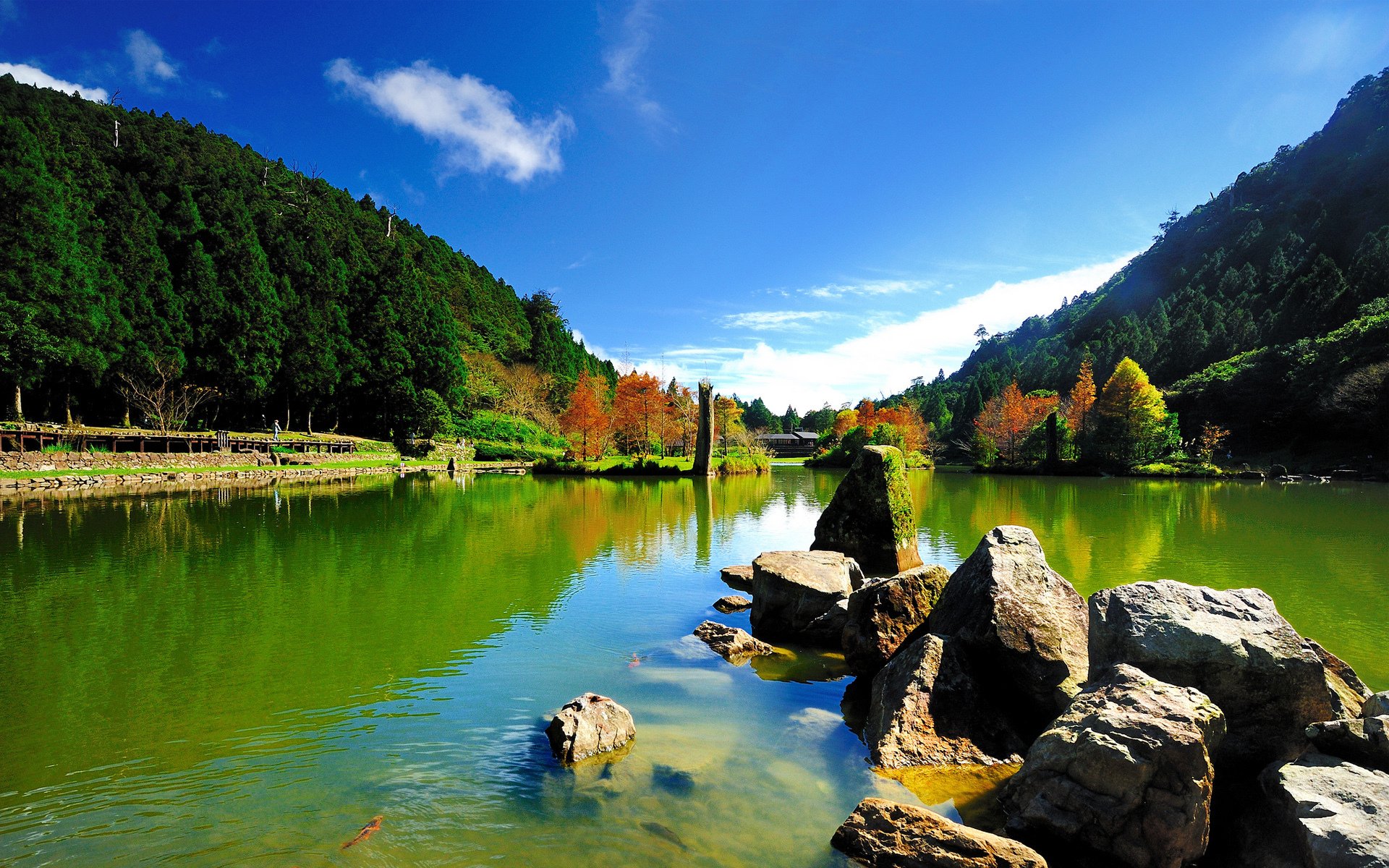 lake pond stones solar hills tree sky fish mo