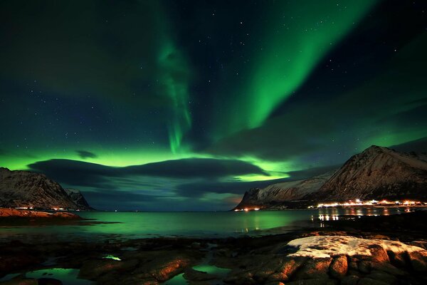 Northern Lights in Norway among the rocks at night