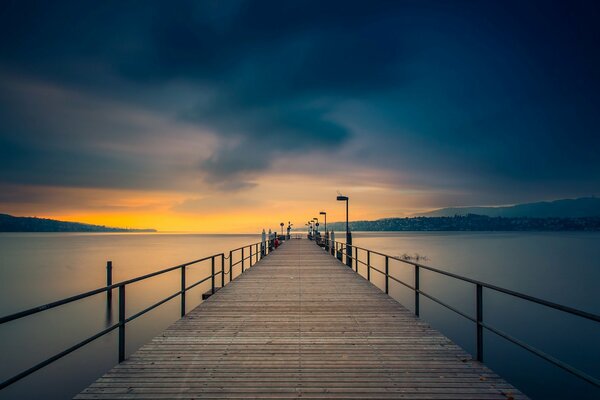 Large-format background, pier on the river