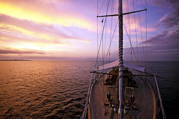 The yacht sails on the sea at dawn