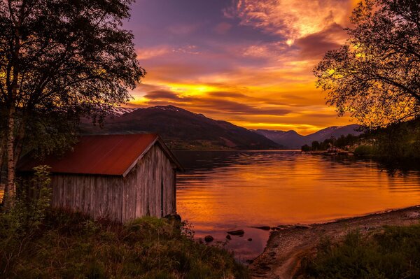 Lake house at sunset in Norway