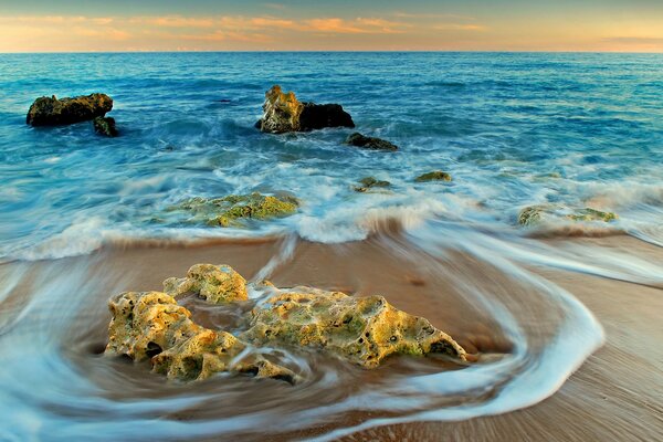 Sea foam on the sand