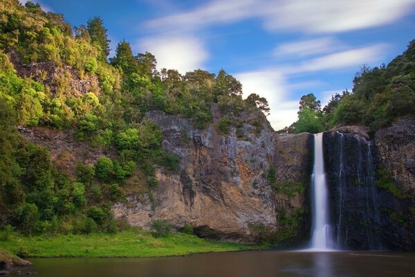 A fast waterfall at a mountain lake