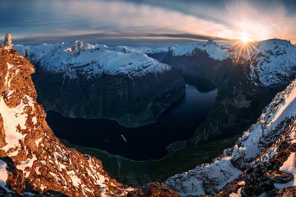 There is a mountain river in the rocks of Norway