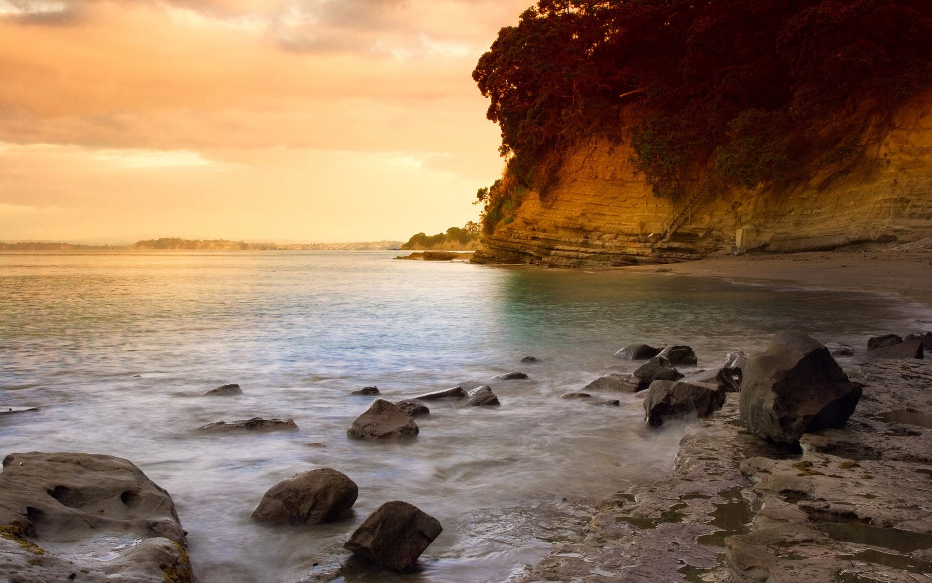 sonnenuntergang strand auckland neuseeland