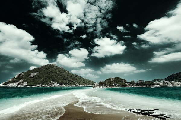 Sea shoal on the background of the sky and mountains