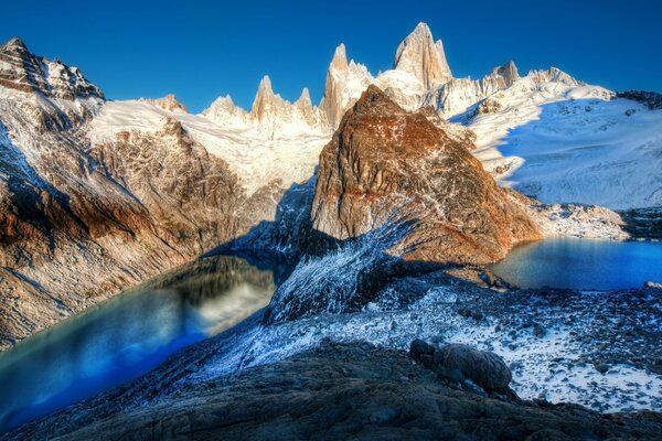 A snow-covered lake in the winter mountains