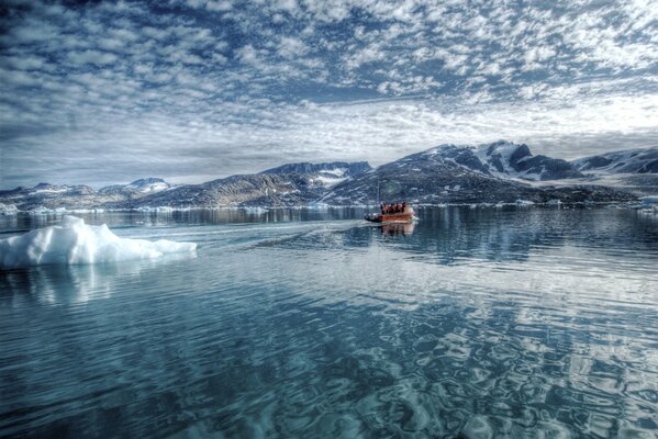 The chilling cold of the water reflects the cirrus clouds