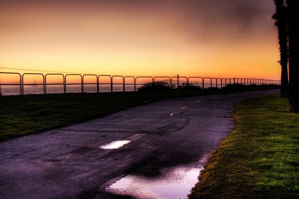 The road next to the embankment in the evening