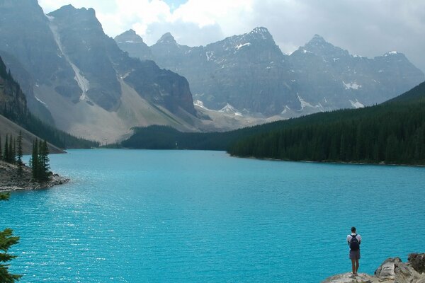 Mountain landscape with blue lake and forest