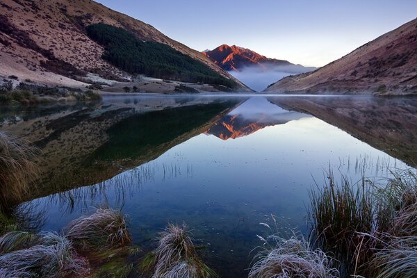 Reflection of mountains in a lake in New Zealand