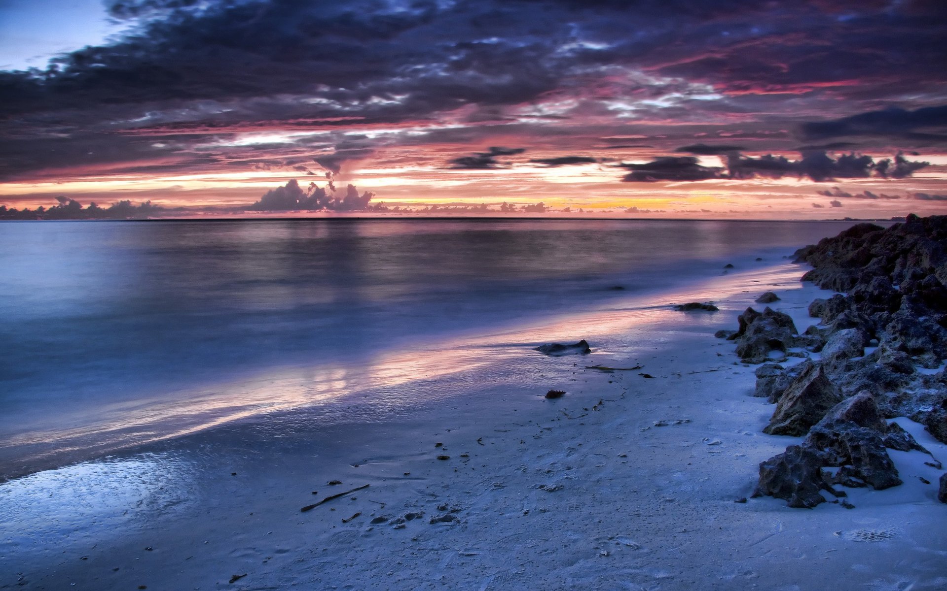 küste sonnenuntergang wolken steine meer