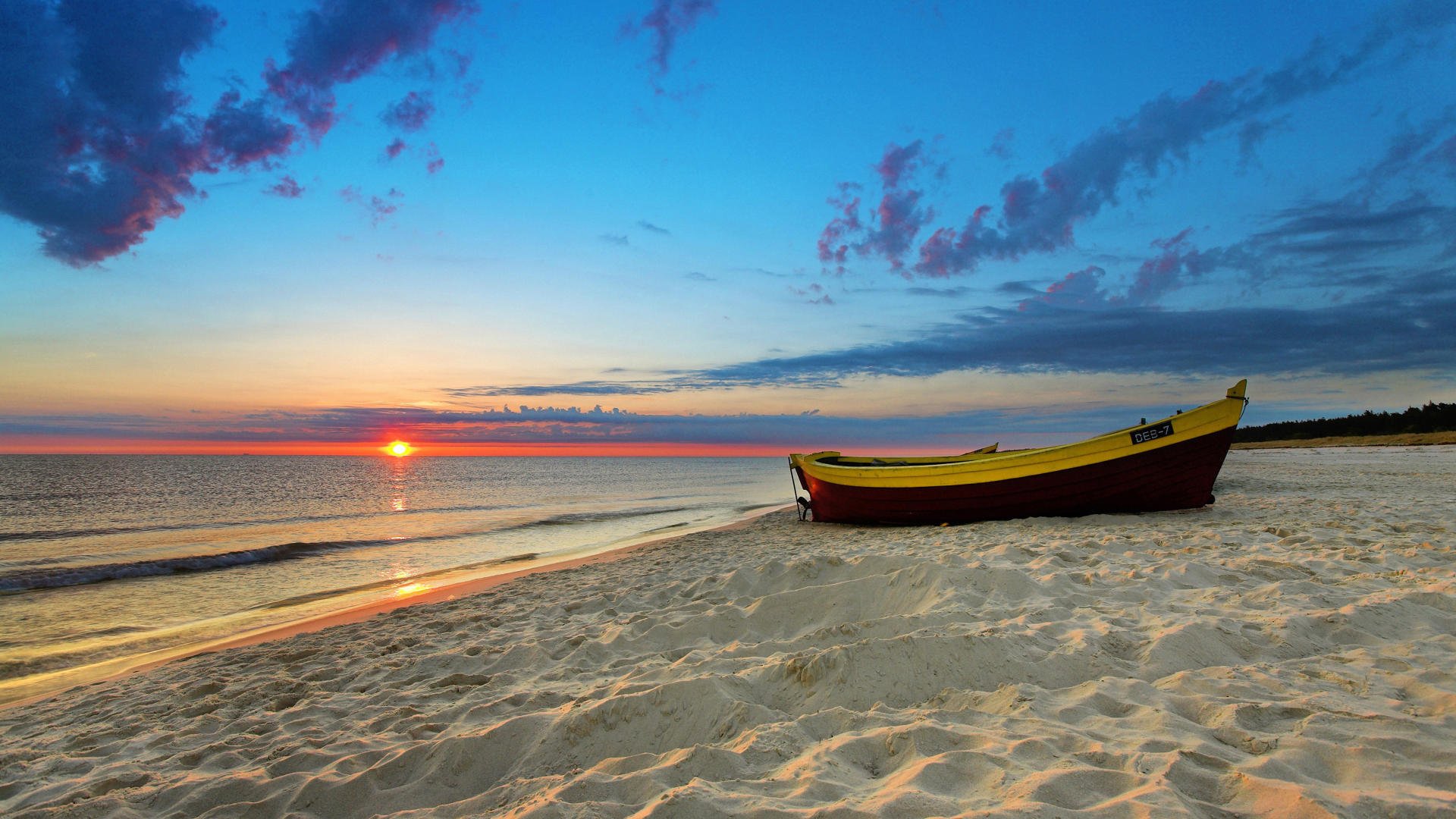 beach sand boat sea sun