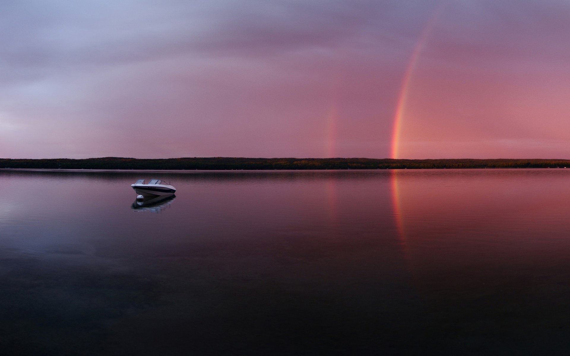 noche lago barco arco iris