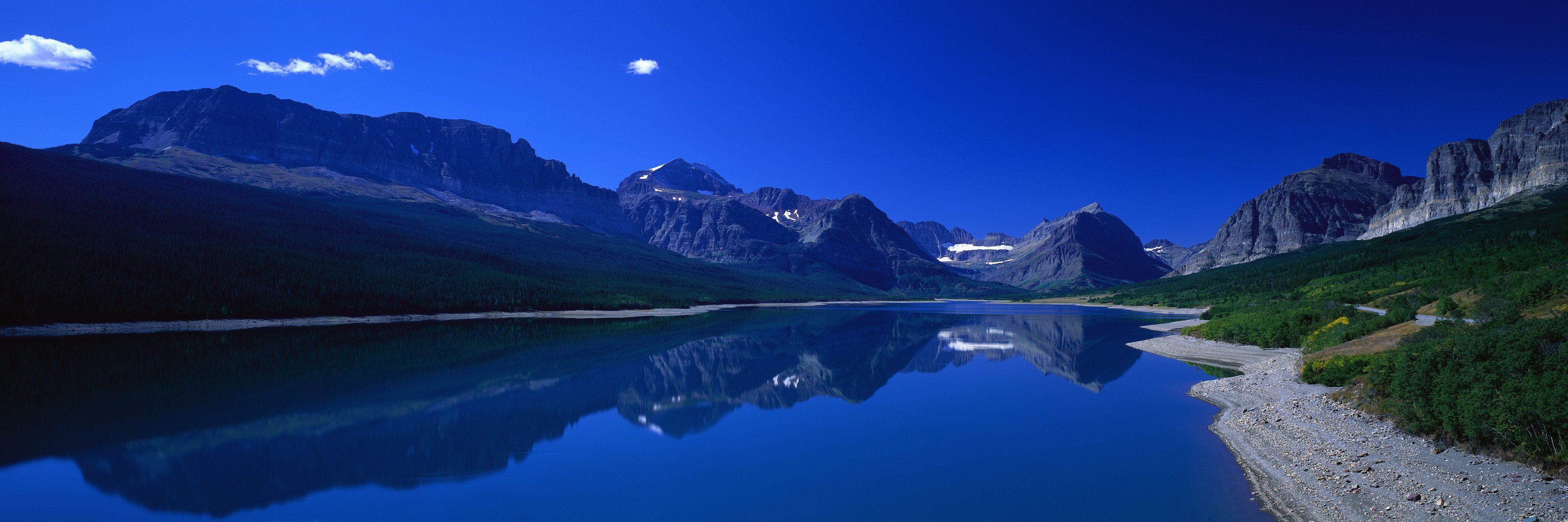 mountain water reflection beach grass sky