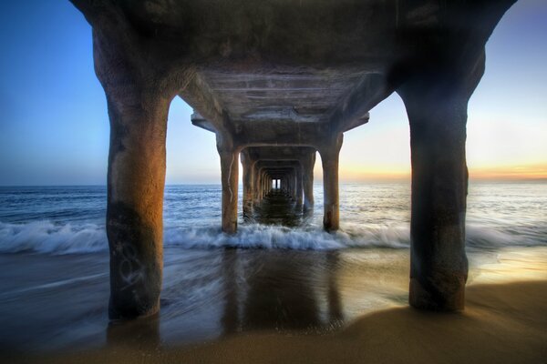 Pier. Sunset on the seashore