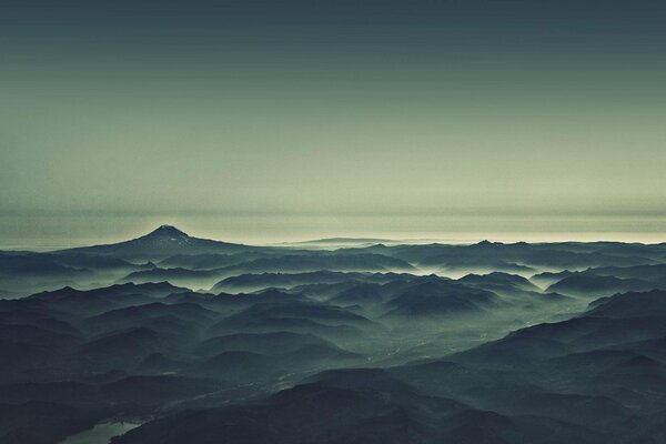 River and mountains in the morning fog