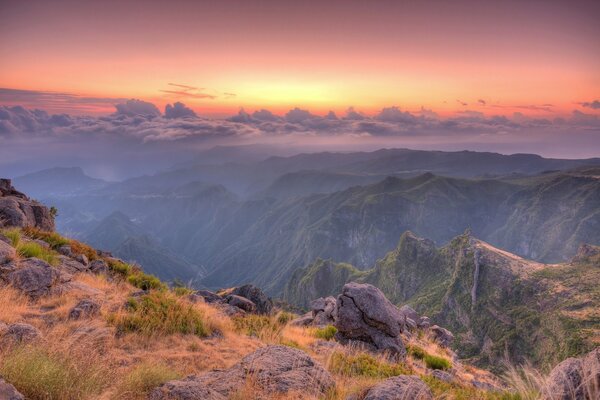 Mountain slopes against the background of clouds