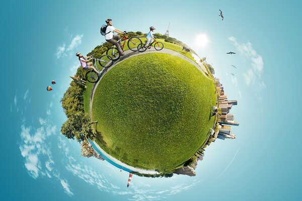 Image de la planète terre sous la forme d une petite boule verte avec des forêts, des bâtiments urbains et des personnes à vélo