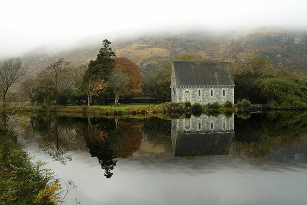 A lonely house in Ireland. Beautiful reflection in the lake