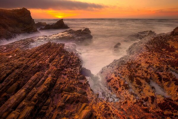 Beautiful sunset and rocky shore