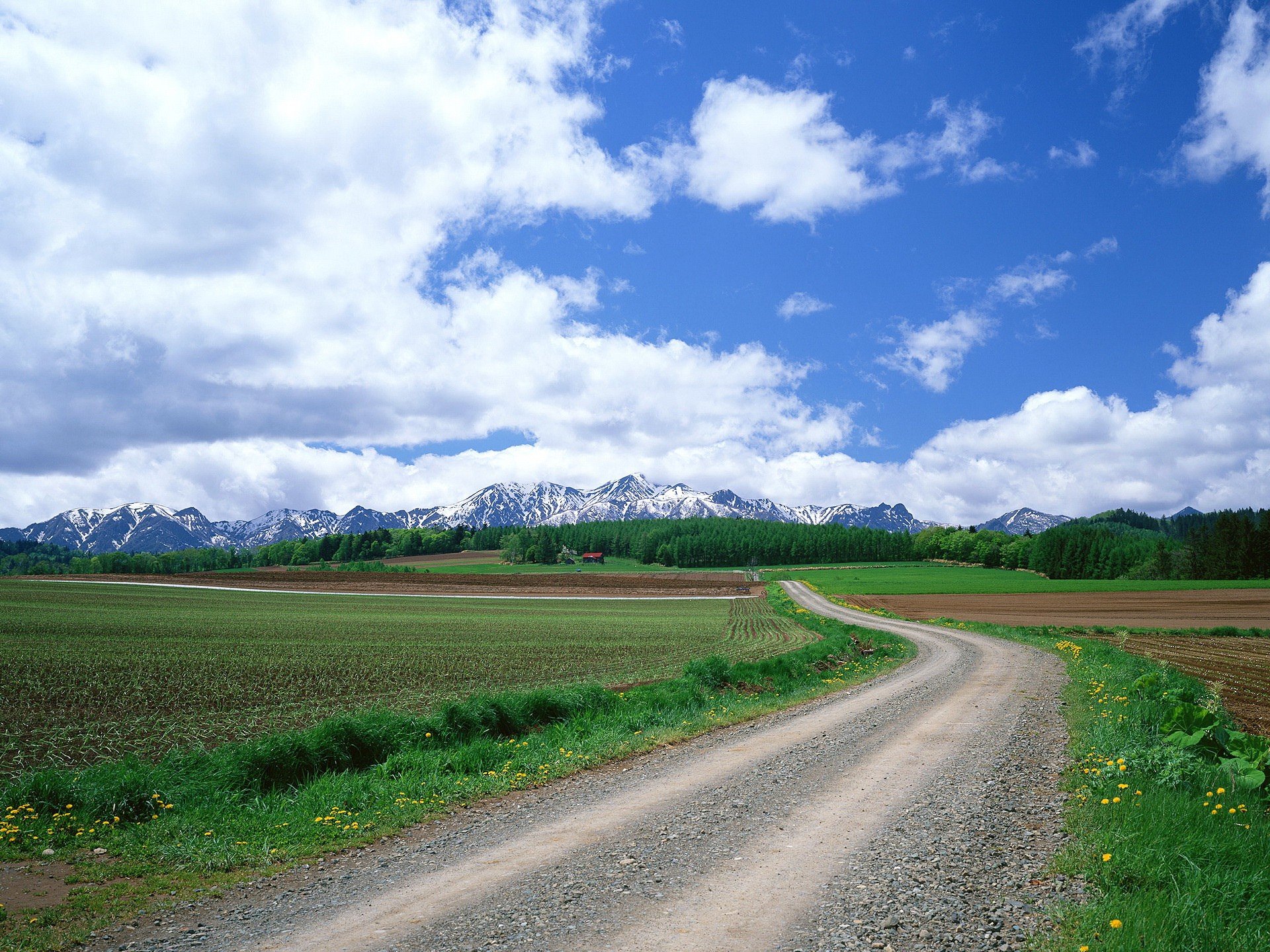 road the field clouds mountain