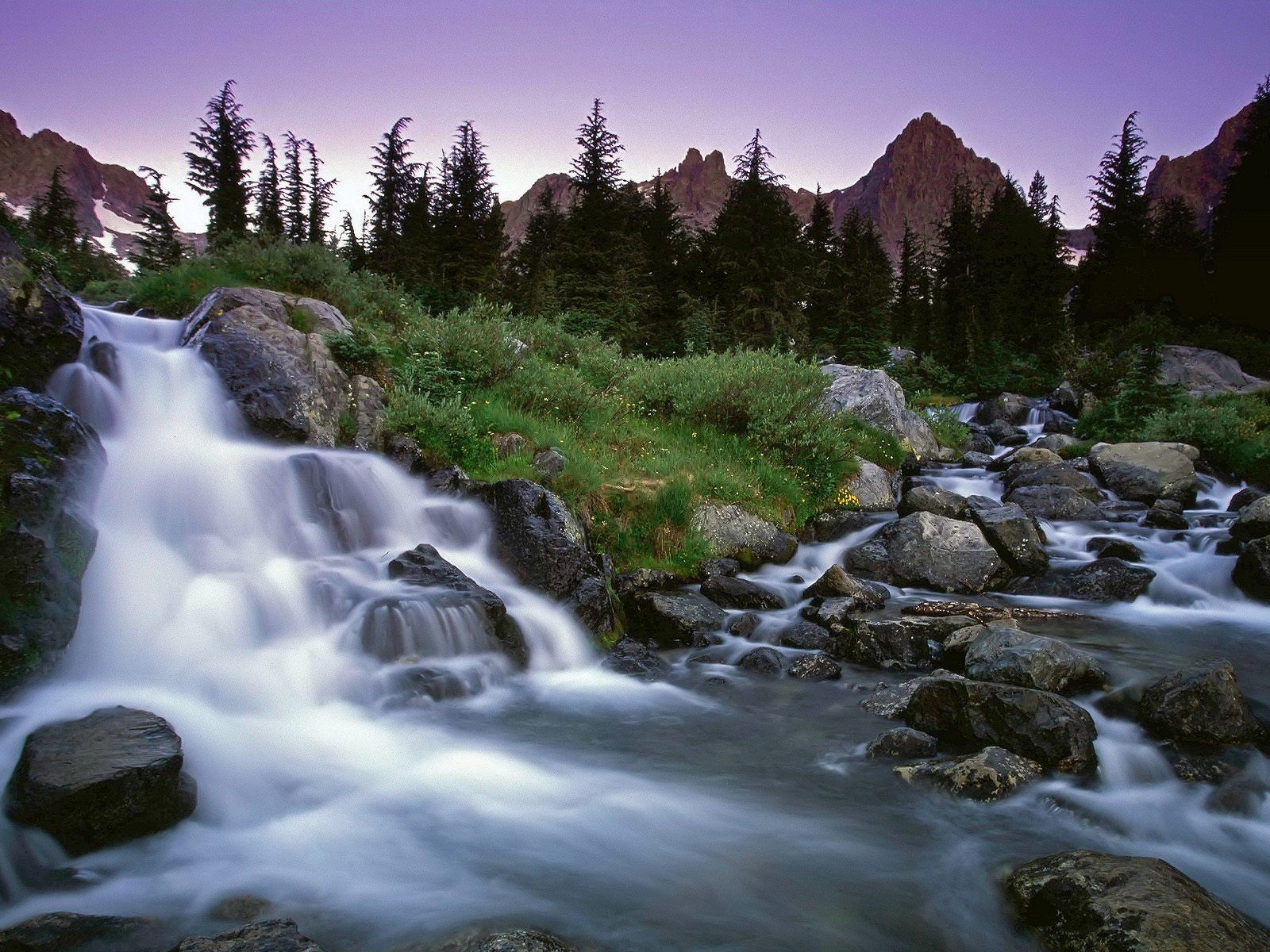 waterfall stones grass tree mountain