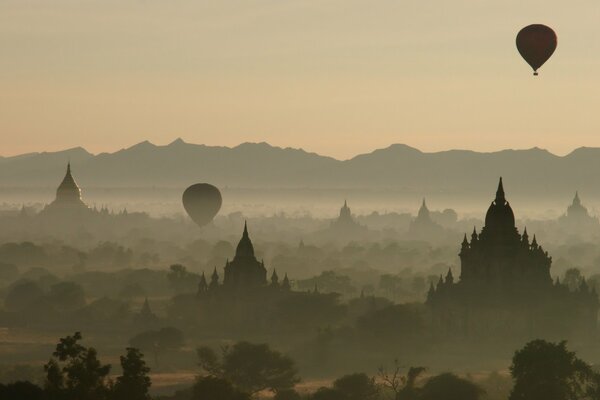 Balloons. Churches in the fog