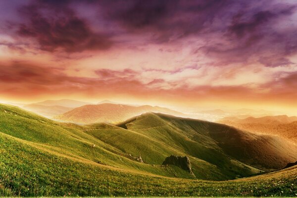 Incredible clouds on the background of green hills