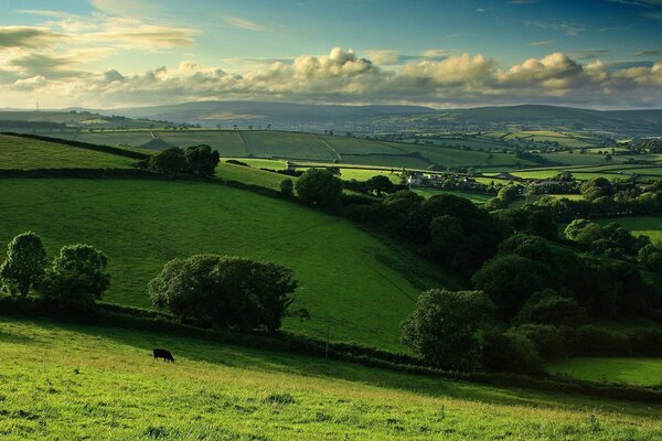 Fabulous hills with painted clouds