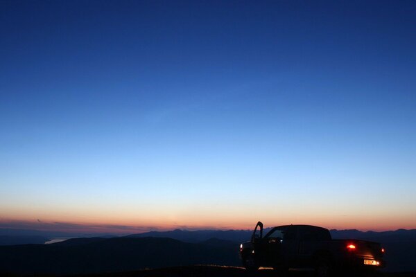 The driver admires the night sky far from civilization