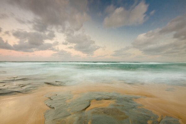 Flat stones of the sandy seashore