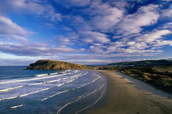 Along the seashore above the clouds, wave, coast, sand