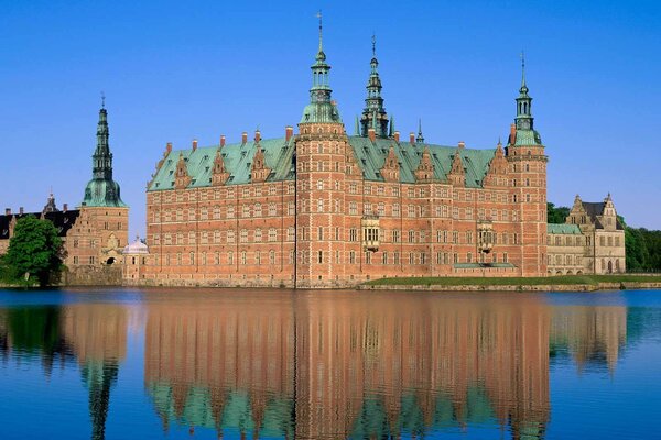 The splendor of Denmark Castle is reflected in the pond