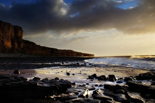 Nature. Night at the sea with a rocky shore