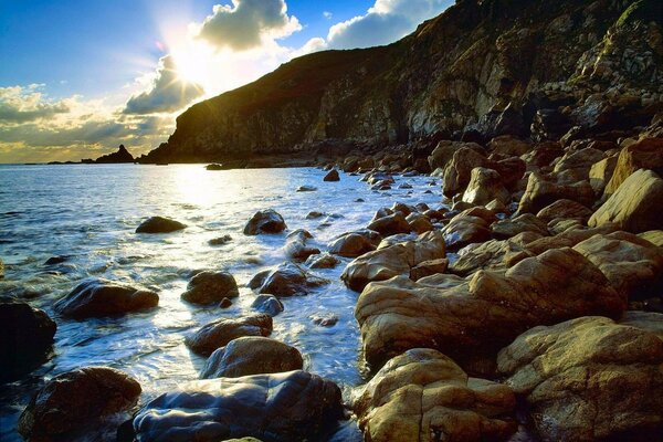 A beach of stones in the sun