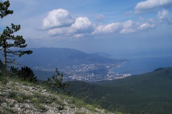 View from the mountain to the mountains, coast, clouds