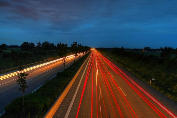 Red and yellow lights on the road at night