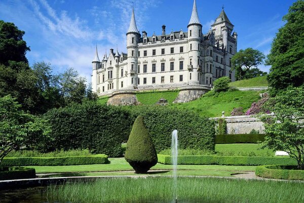 A white castle in Scotland on a hill. highland