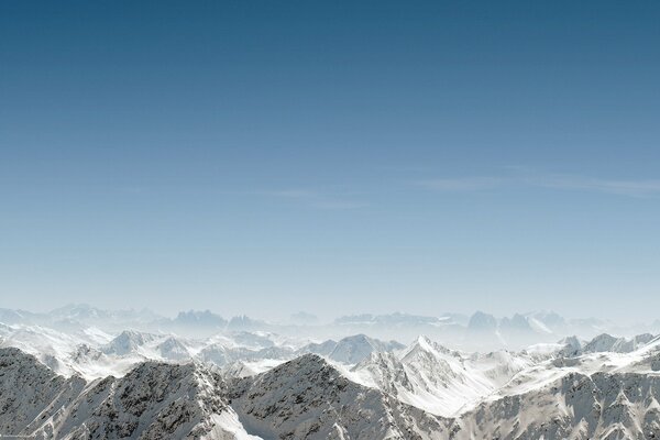 Landscape of mountain tops with snow